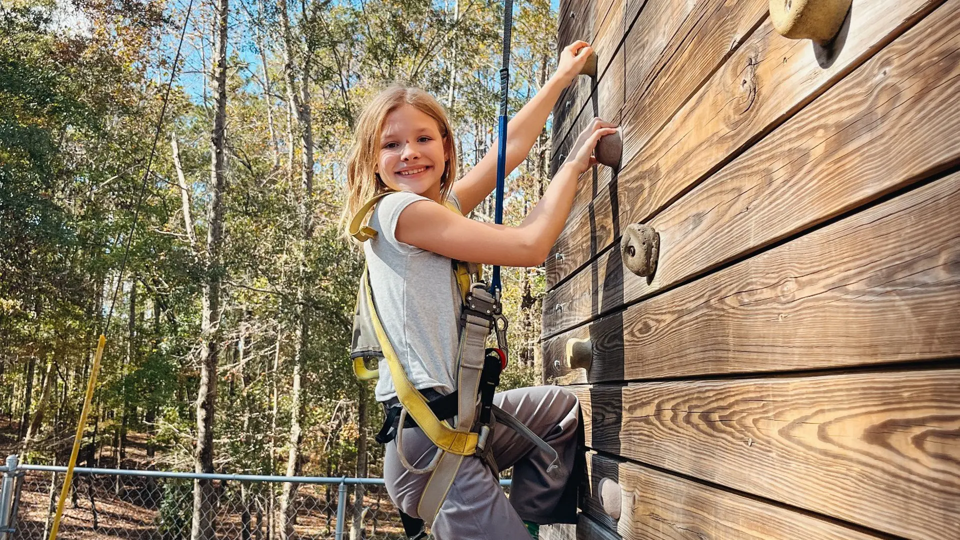 Student Climbing An Outdoor Rock Wall During A Weekend Adventure Trip At Butter And Egg Adventures In Troy, Alabama